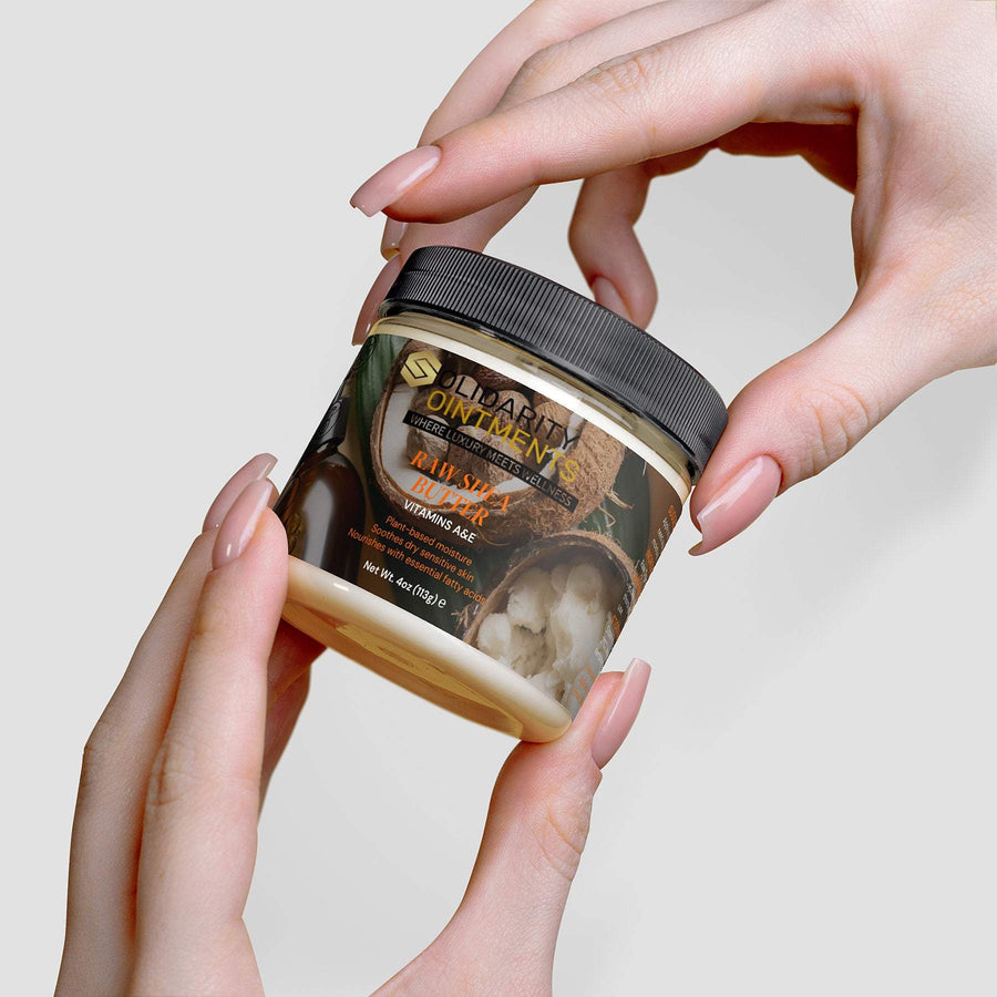 Organic raw shea butter jar held by hands, 4 oz, vegan, cruelty-free, deeply moisturizing.