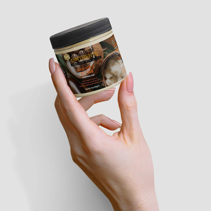 Organic Raw Shea Butter in a jar held in hand, deeply moisturizing, unrefined, vegan, cruelty-free skincare essential.