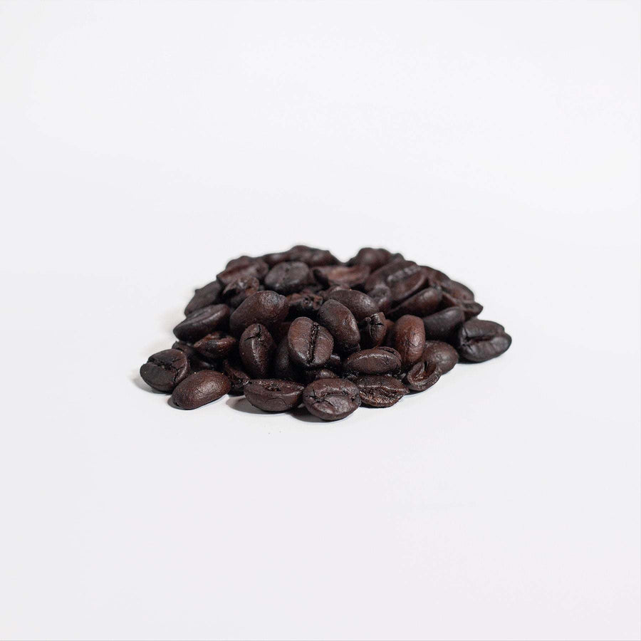 Medium-dark roasted Arabica coffee beans infused with authentic Manuka honey from New Zealand.