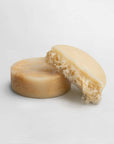 Exfoliating luffa soap bar with natural fibers for silky smooth skin.