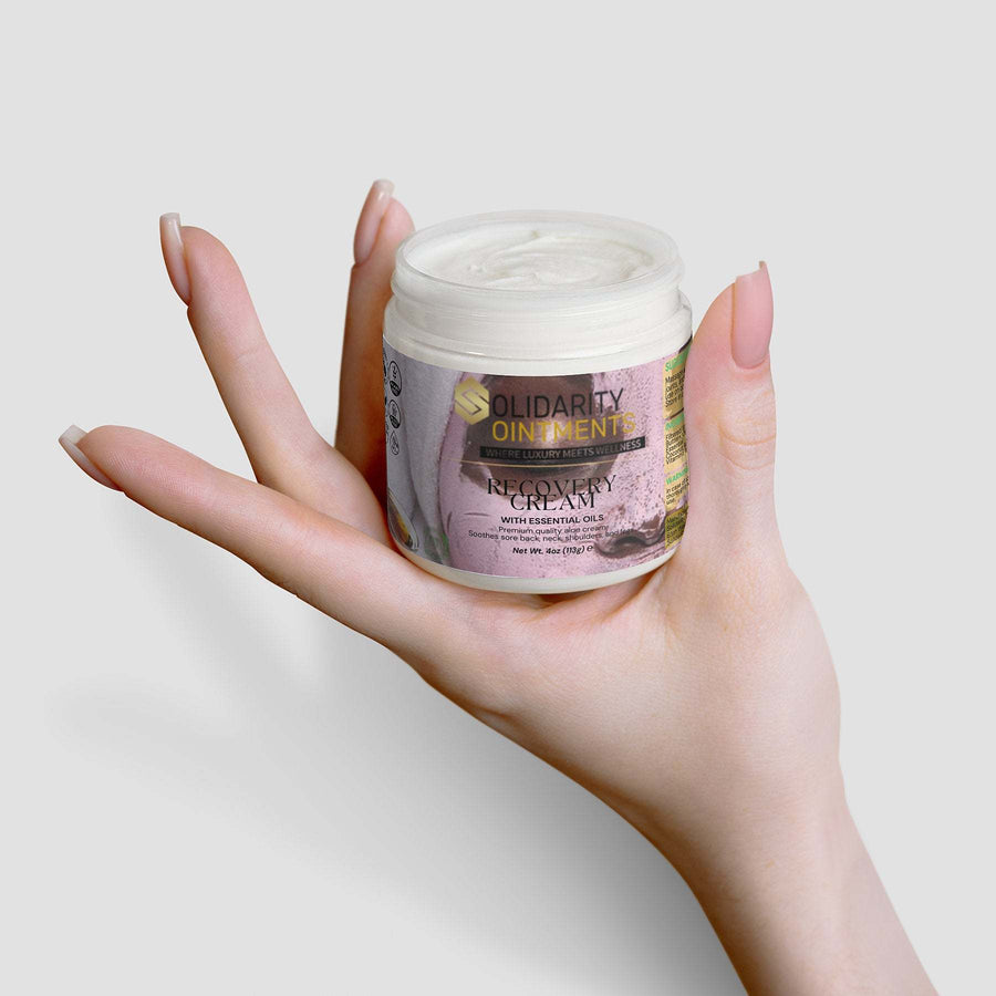 Recovery cream jar held in hand, premium skincare, 4 oz, USA-made.