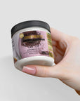 Recovery cream jar held by a person, featuring premium skincare ingredients for hydration and comfort.