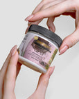 Recovery Cream in a jar being held, premium skincare with aloe and essential oils for hydration and relaxation.