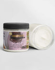 Recovery cream in glass jar with black lid, featuring essential oils for skin hydration and relaxation.