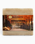 Rich Sandalwood Soap bar with luxurious handcrafted label, ideal for sensitive skin.